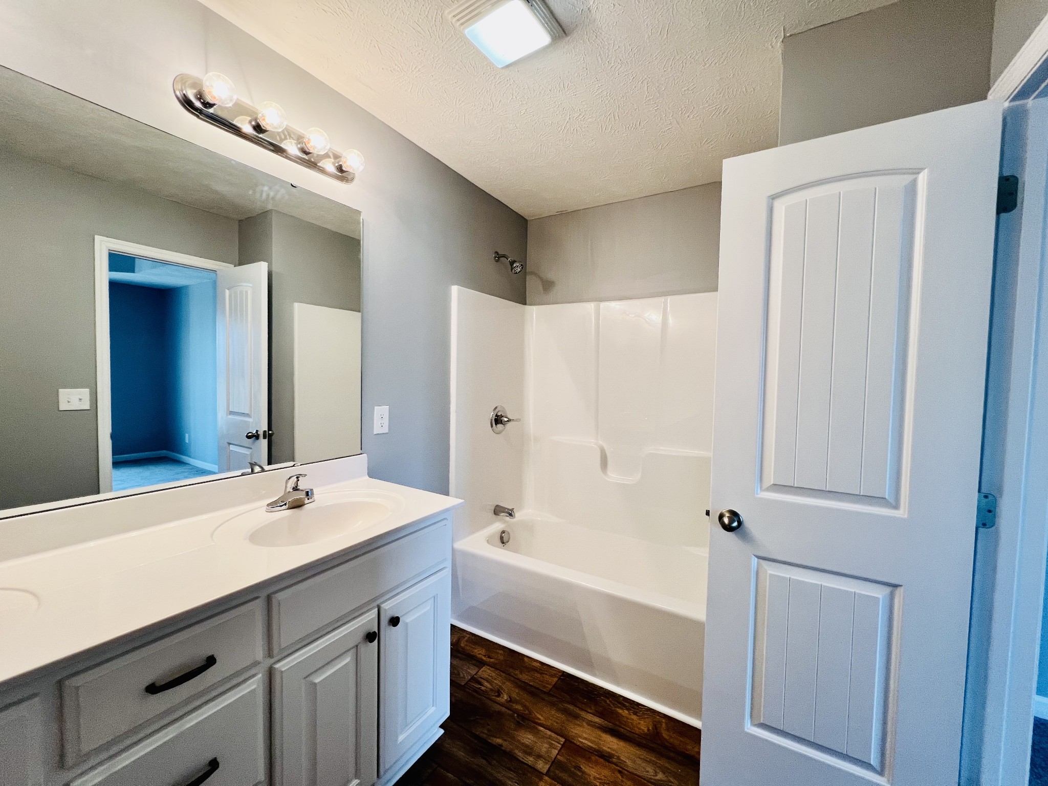 4759 Little Dry Creek Road Pulaski, TN 38478 - Photo 8 of 18 a bathroom with a tub a sink and mirror