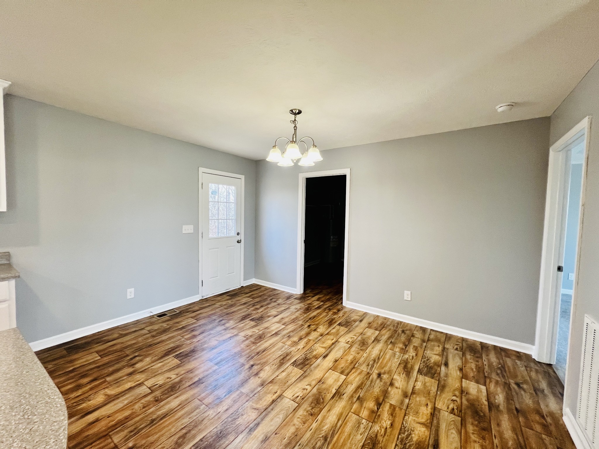 4759 Little Dry Creek Road Pulaski, TN 38478 - Photo 10 of 18 a view of an empty room with window and wooden floor