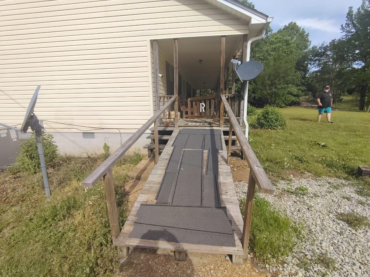 1475 Authur Byrd Road Pocahontas, TN 38061 - Photo 34 of 37 Front porch with wood railing, supported by columns, and a coordinating wood ramp