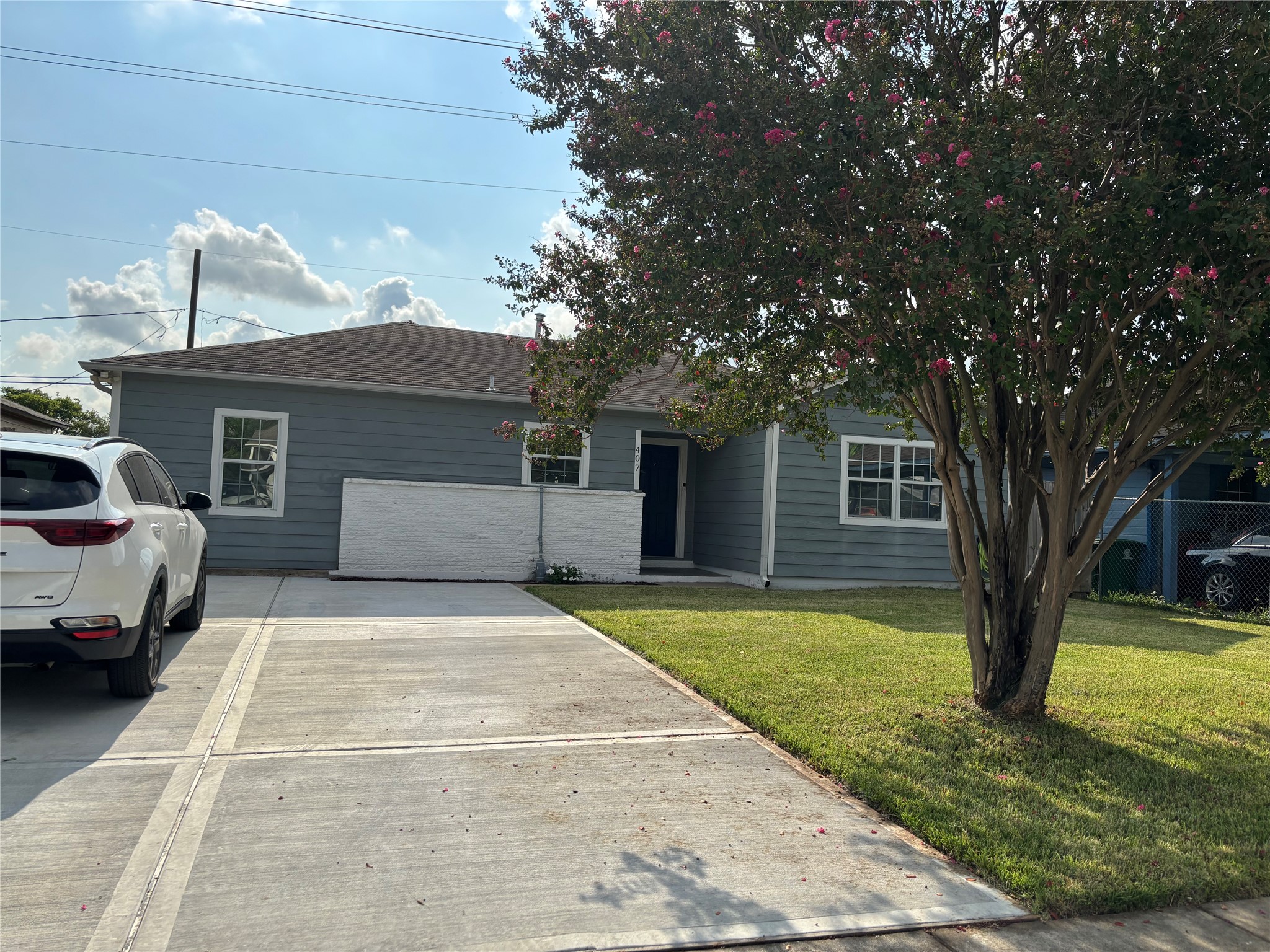 Front of house with double driveway.