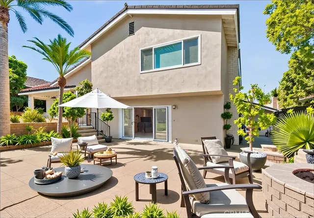 a view of a chairs and table in the patio