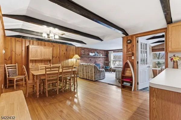 a kitchen with refrigerator and cabinets