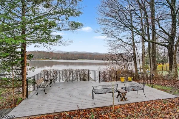 an aerial view of residential house with outdoor space and lake view
