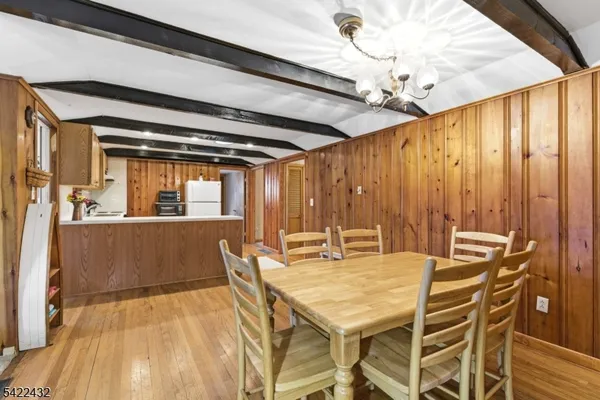 a dining room with furniture and windows