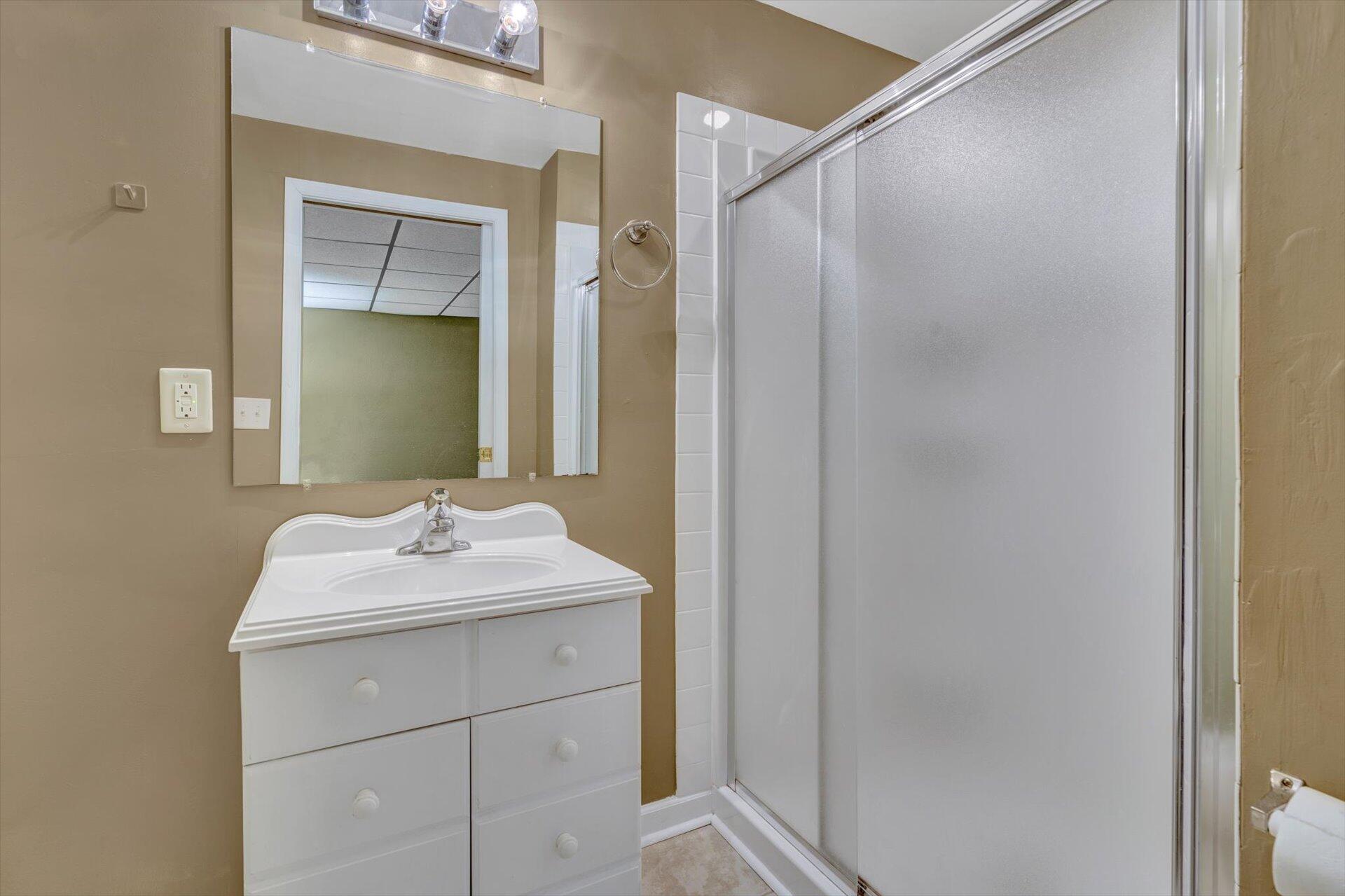 2910 Tree Swallow Road Roanoke, VA 24018 - Photo 31 of 36 a bathroom with a sink and a mirror