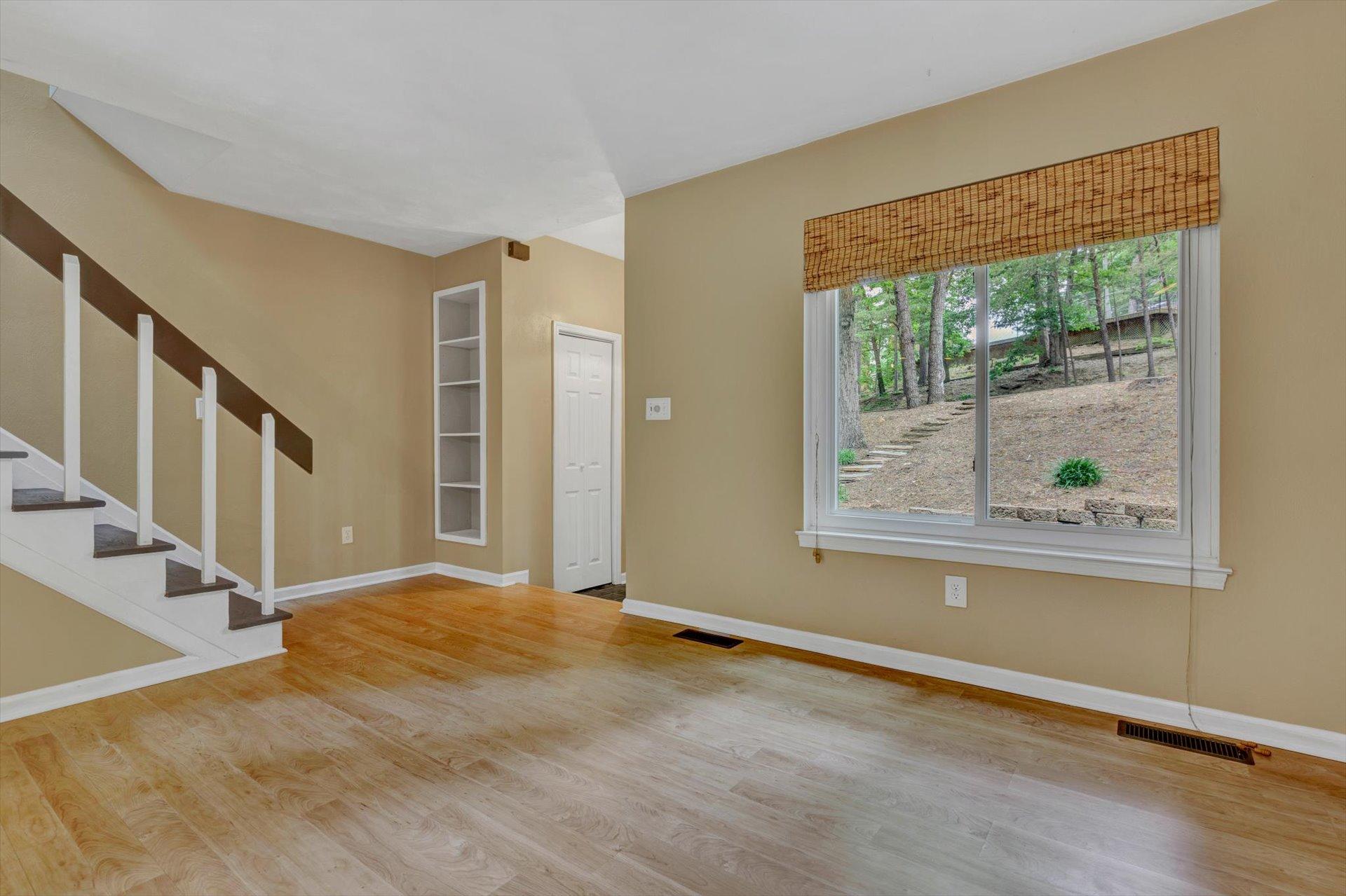 2910 Tree Swallow Road Roanoke, VA 24018 - Photo 6 of 36 a view of an empty room with wooden floor and a window