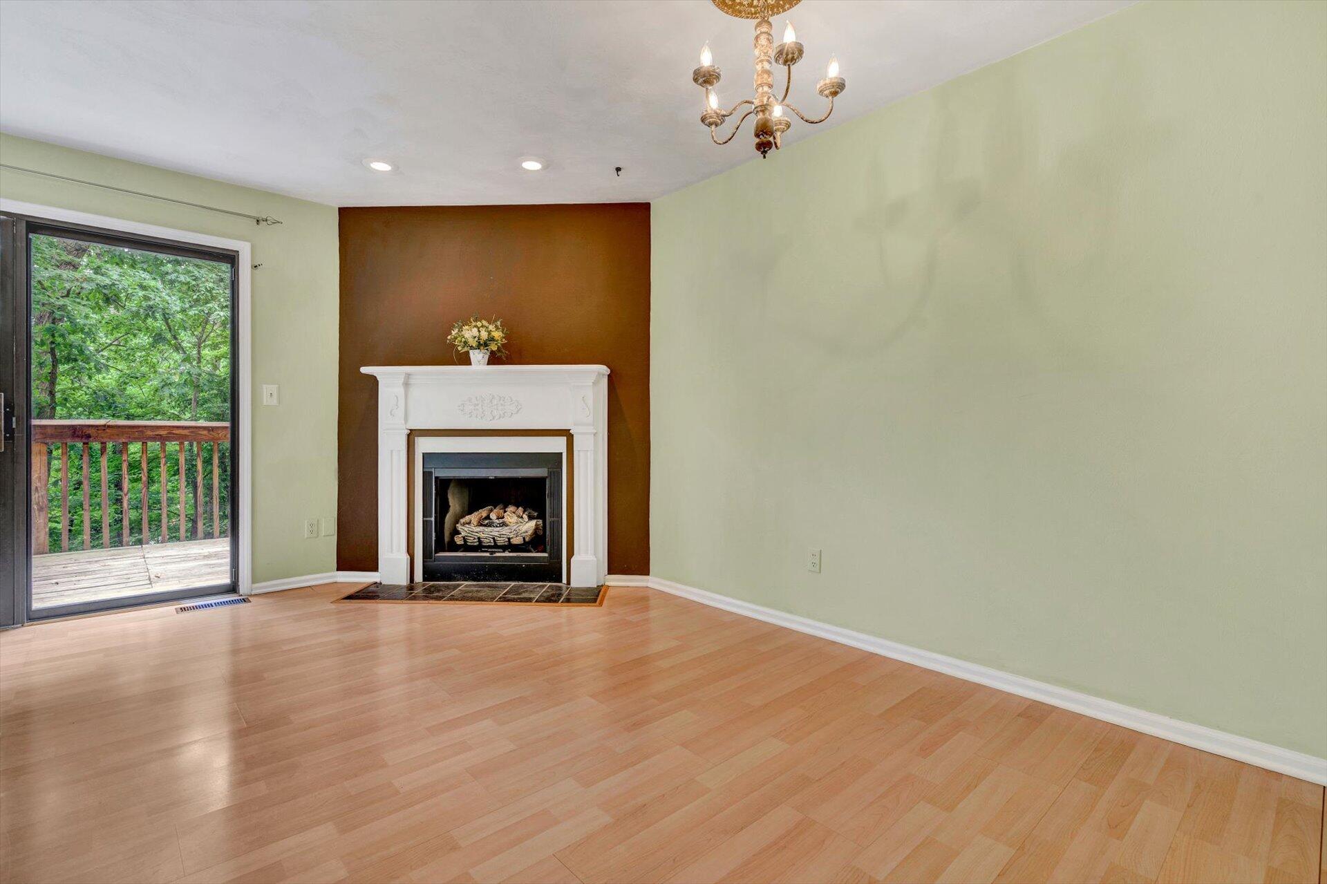 2910 Tree Swallow Road Roanoke, VA 24018 - Photo 9 of 36 a view of an empty room with a fireplace and a window