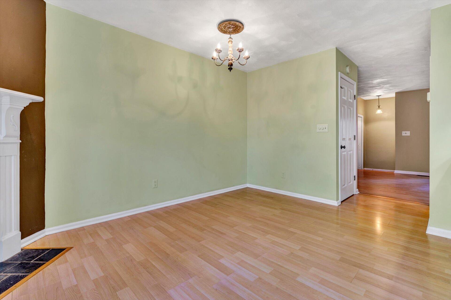 2910 Tree Swallow Road Roanoke, VA 24018 - Photo 10 of 36 wooden floor in an empty room with a window
