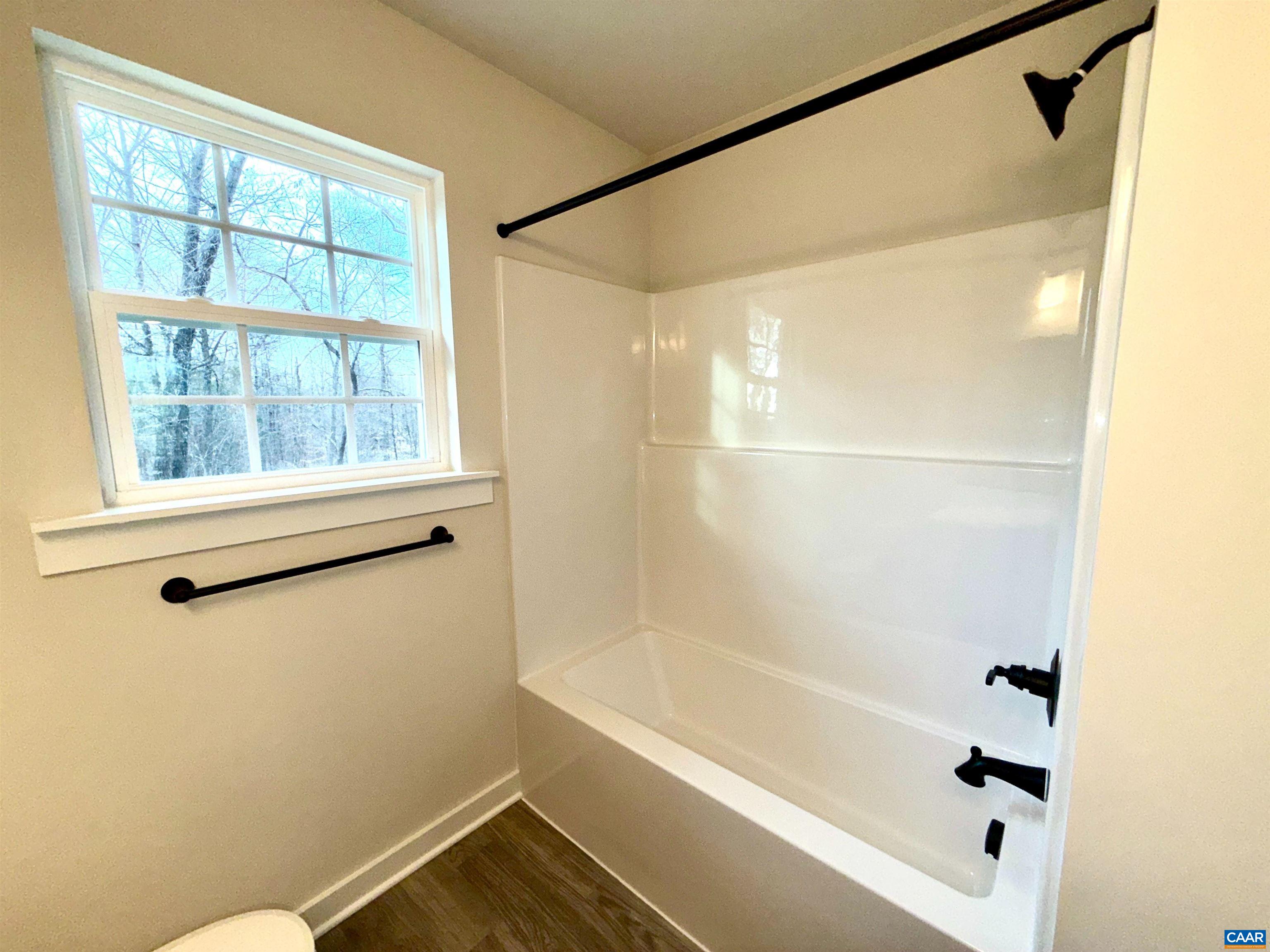 3546 Courthouse Road, Unit CBE4 Palmyra, VA 22963 - Photo 12 of 19 a bathroom with a bathtub and a shower