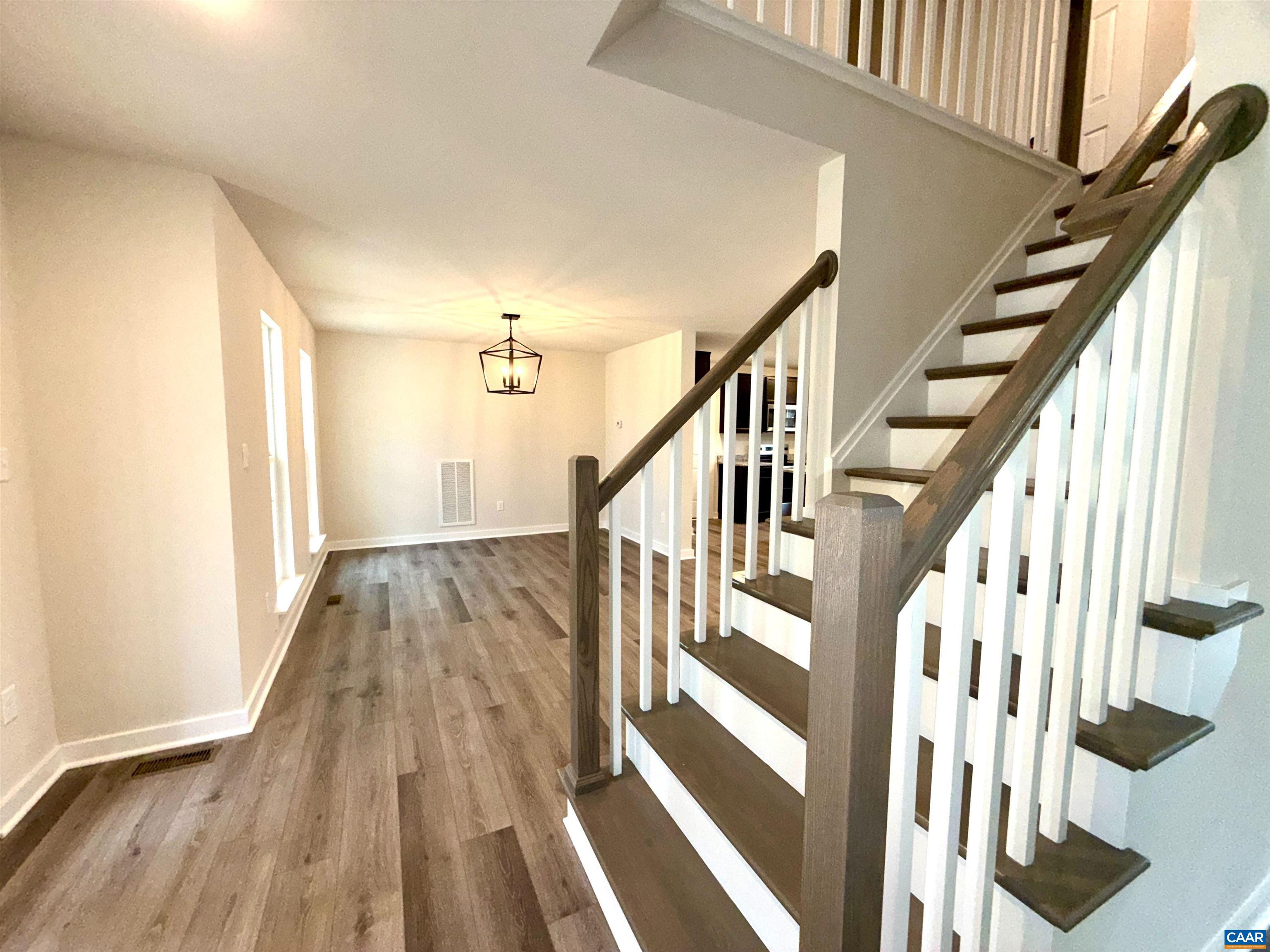 3546 Courthouse Road, Unit CBE4 Palmyra, VA 22963 - Photo 19 of 19 a view of staircase with wooden floor and white walls