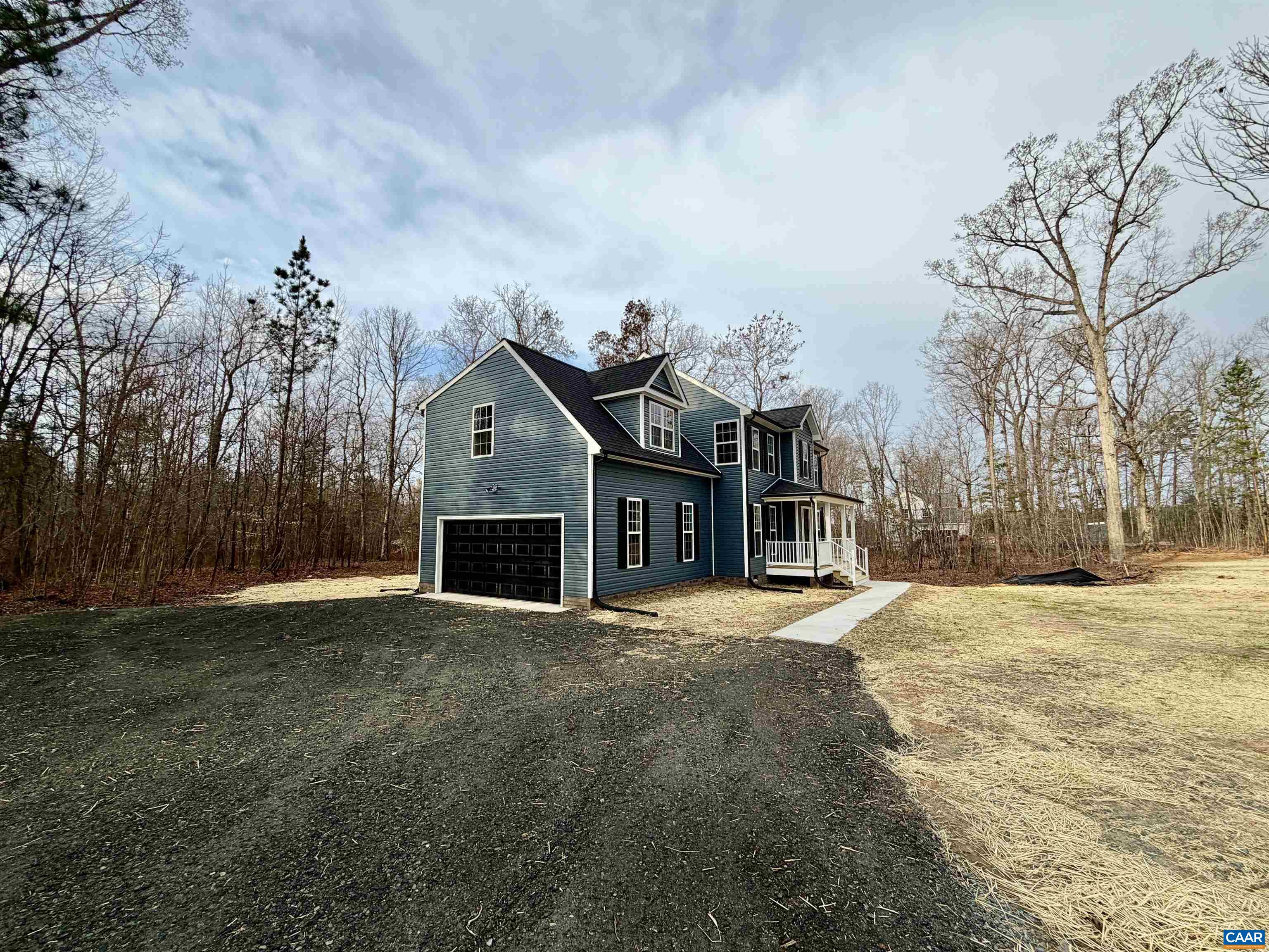 3546 Courthouse Road, Unit CBE4 Palmyra, VA 22963 - Photo 3 of 19 a front view of a house with a yard and garage