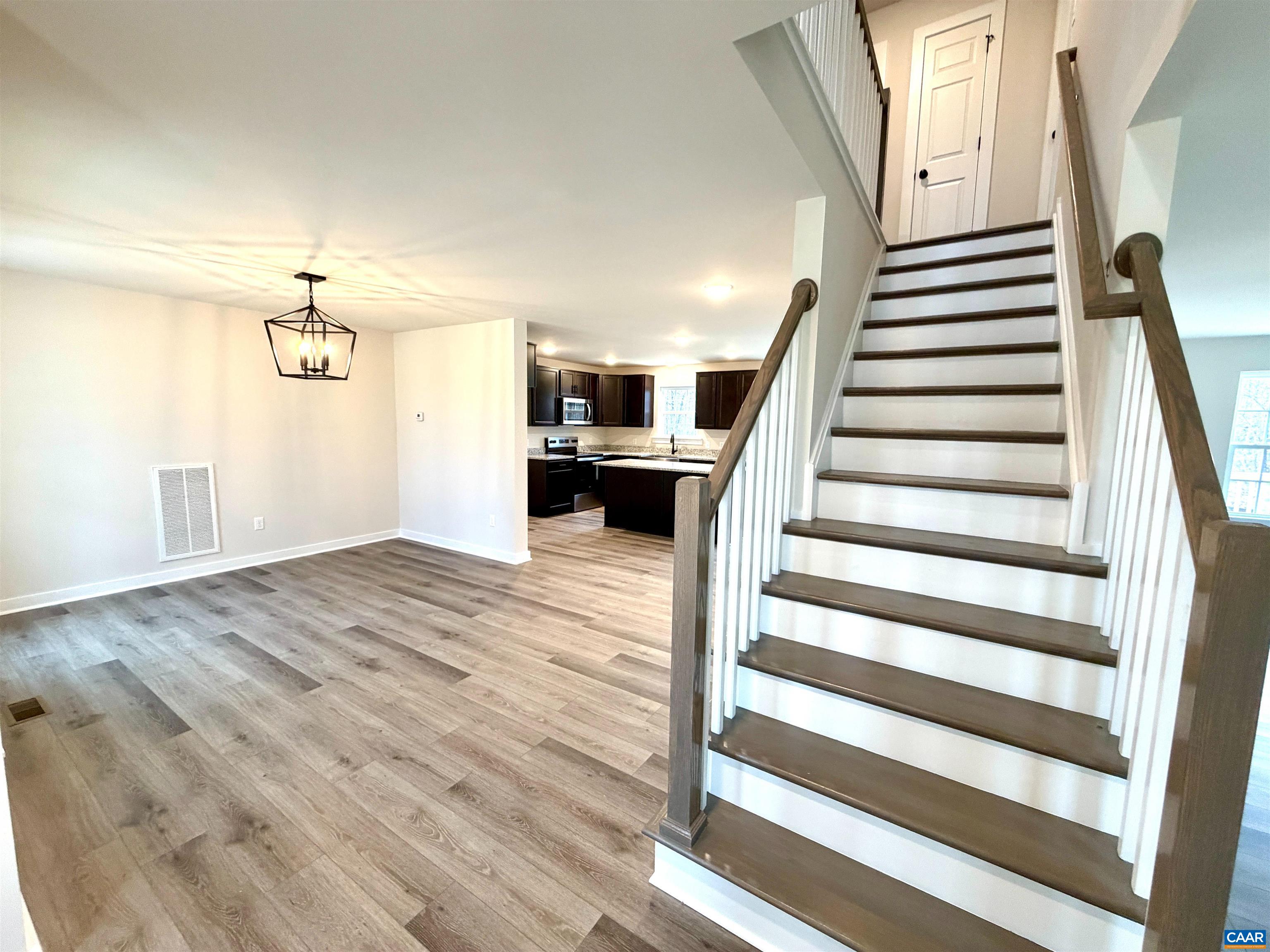 3546 Courthouse Road, Unit CBE4 Palmyra, VA 22963 - Photo 4 of 19 a view of a livingroom with wooden floor and stairs