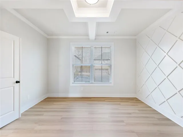 a view of kitchen with granite countertop stainless steel appliances sink and cabinets