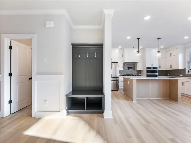 a view of entryway with wooden floor