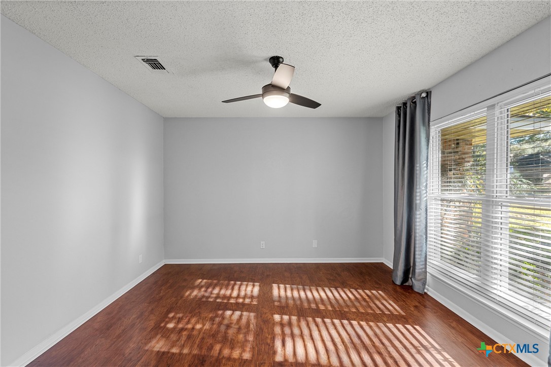 2014 Forest Trail Temple, TX 76502 - Photo 13 of 38 wooden floor in an empty room with a window