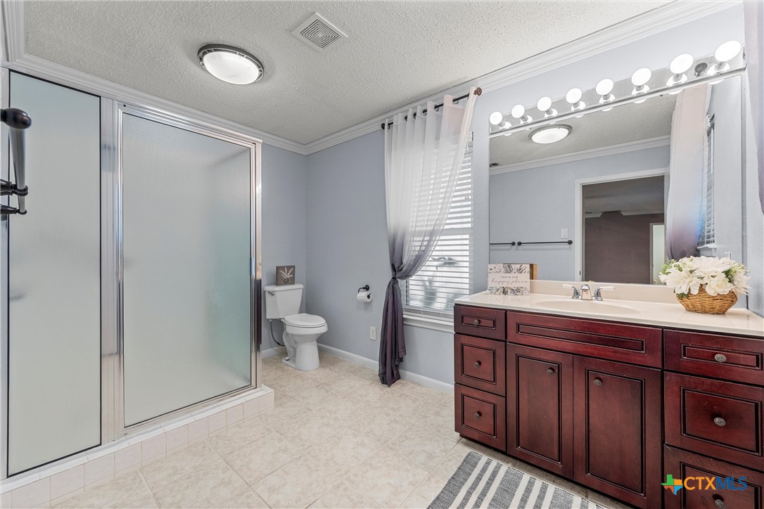 2014 Forest Trail Temple, TX 76502 - Photo 18 of 38 a spacious bathroom with a granite countertop sink mirror and a toilet