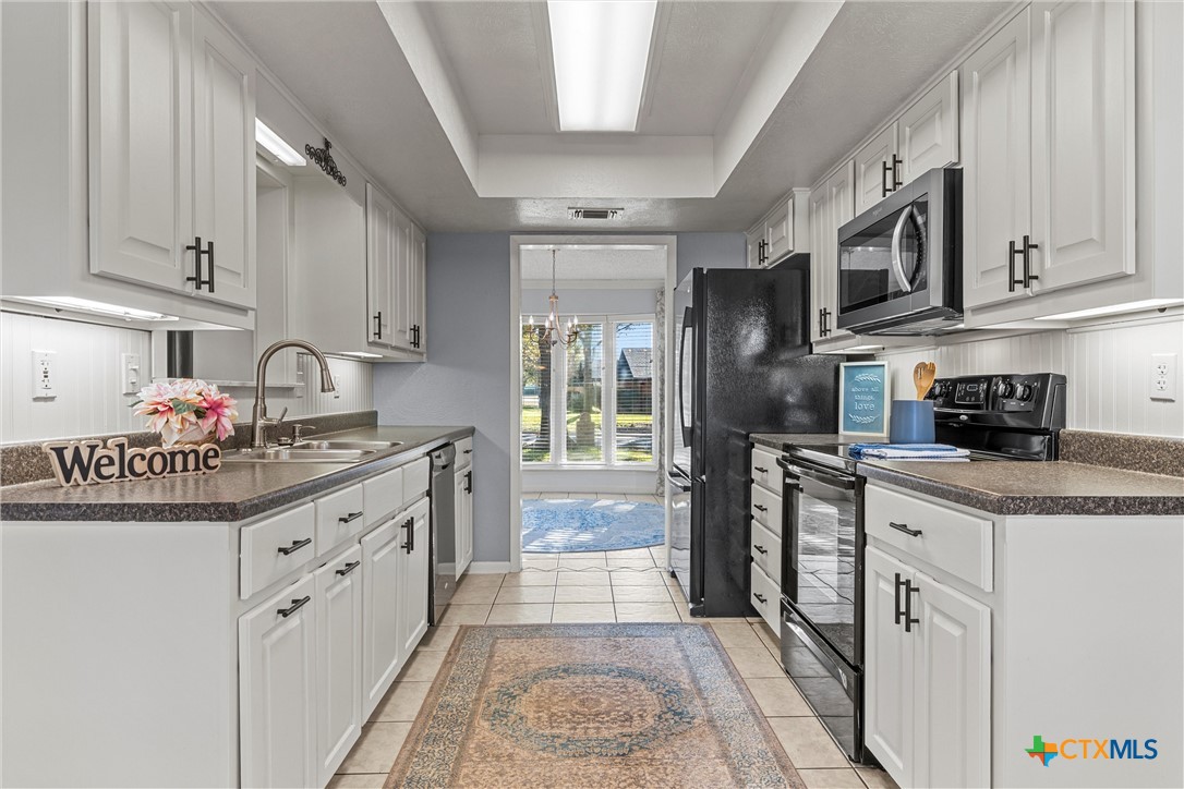 2014 Forest Trail Temple, TX 76502 - Photo 8 of 38 a kitchen with stainless steel appliances granite countertop a stove a sink and a refrigerator
