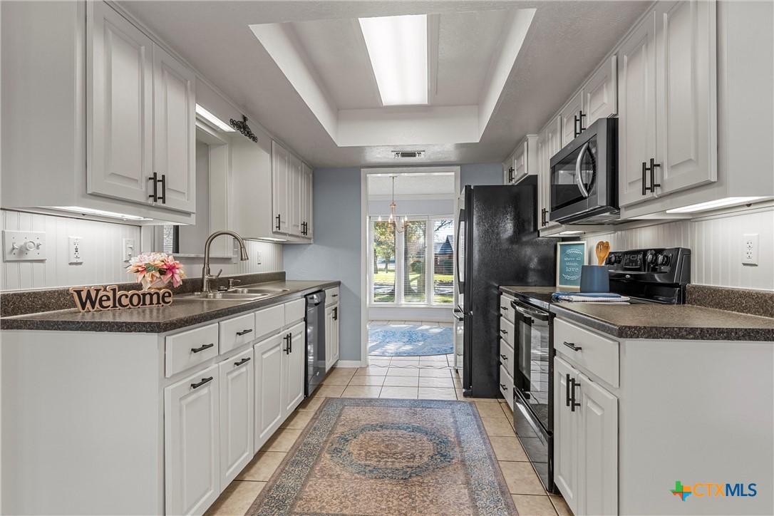 2014 Forest Trail Temple, TX 76502 - Photo 9 of 38 a kitchen with stainless steel appliances granite countertop a sink and cabinets