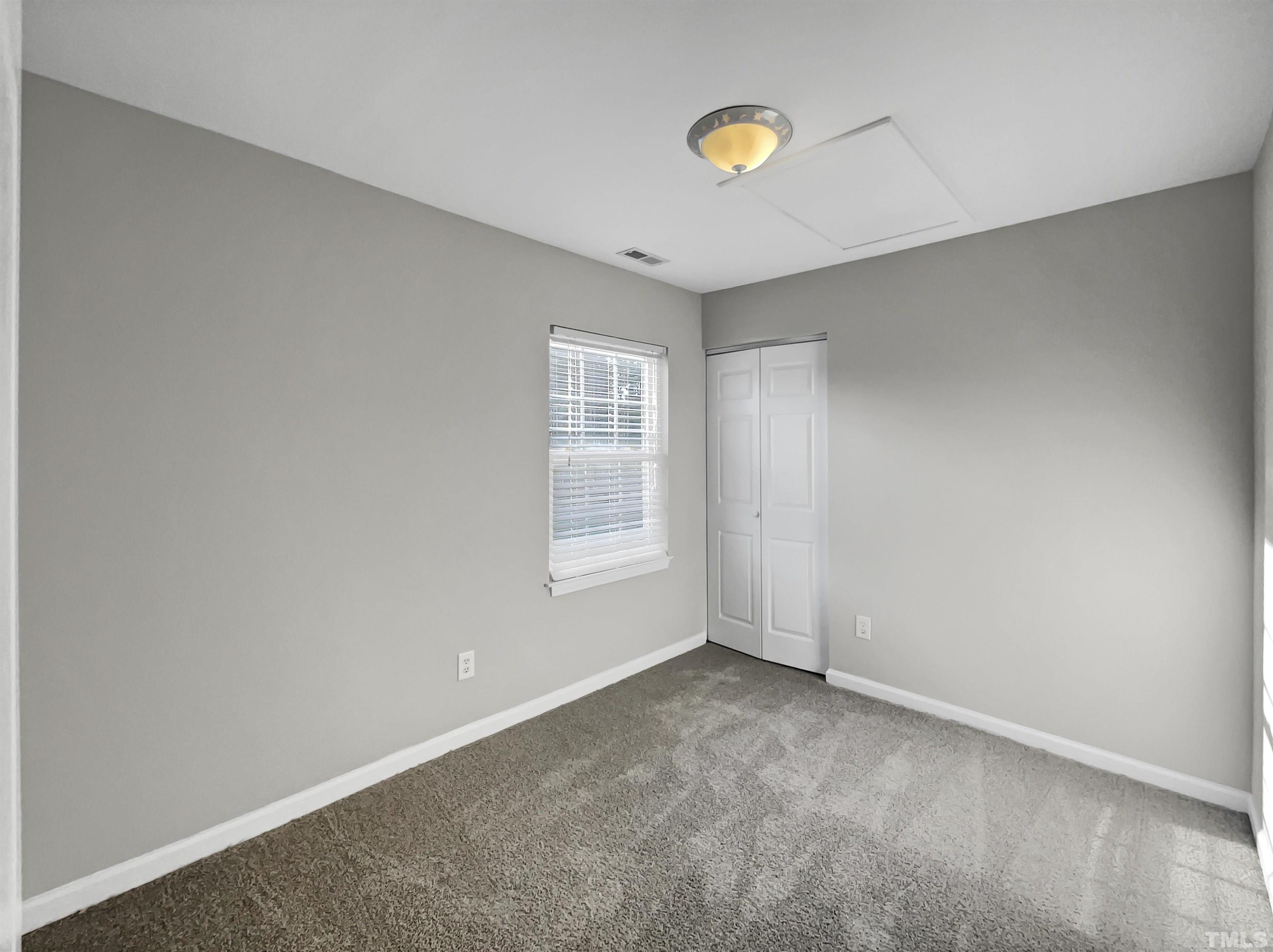 2829 Midway Park Court Raleigh, NC 27610 - Photo 12 of 16 an empty room with windows