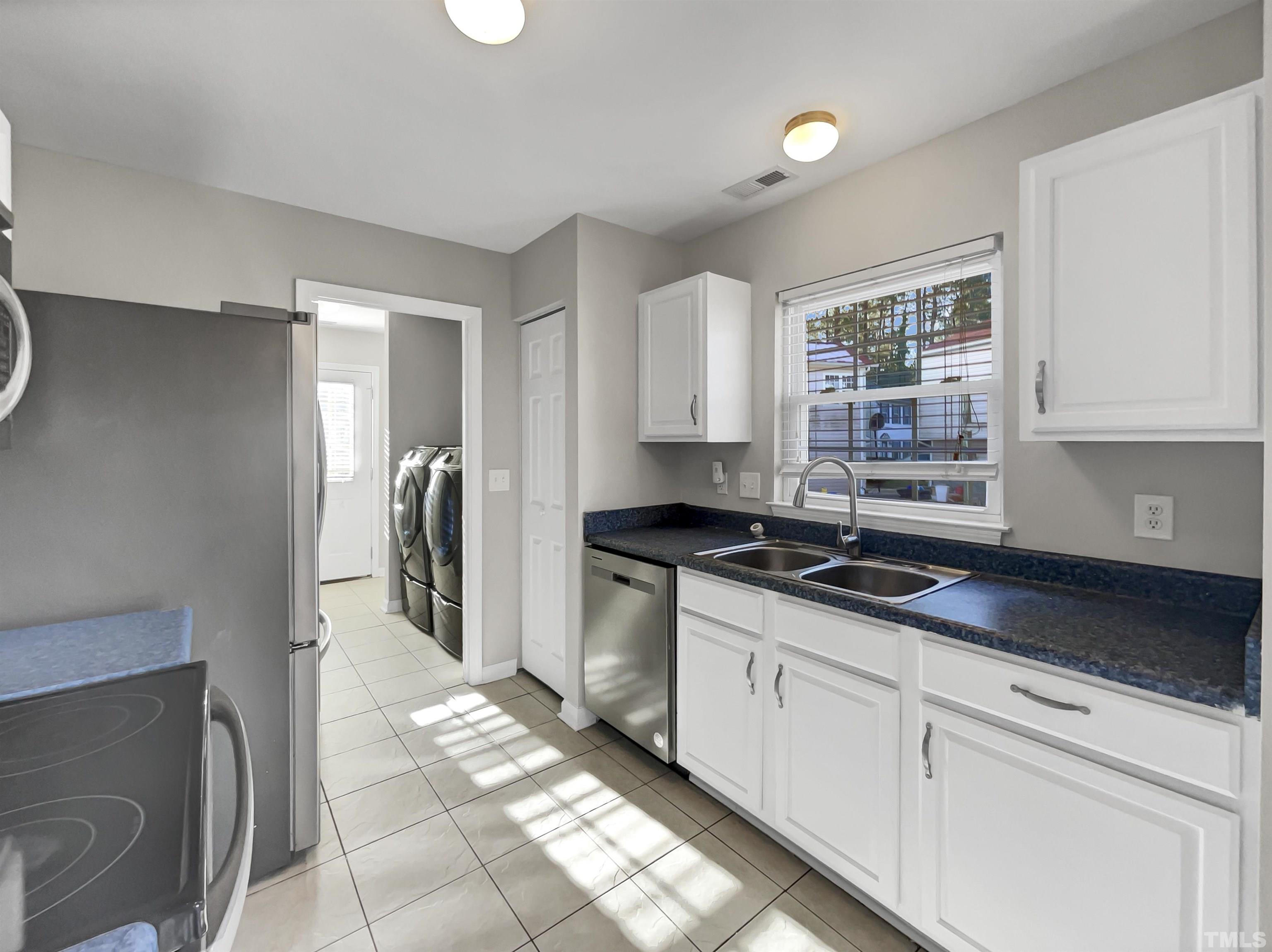 2829 Midway Park Court Raleigh, NC 27610 - Photo 6 of 16 a kitchen with stainless steel appliances granite countertop a sink and a stove