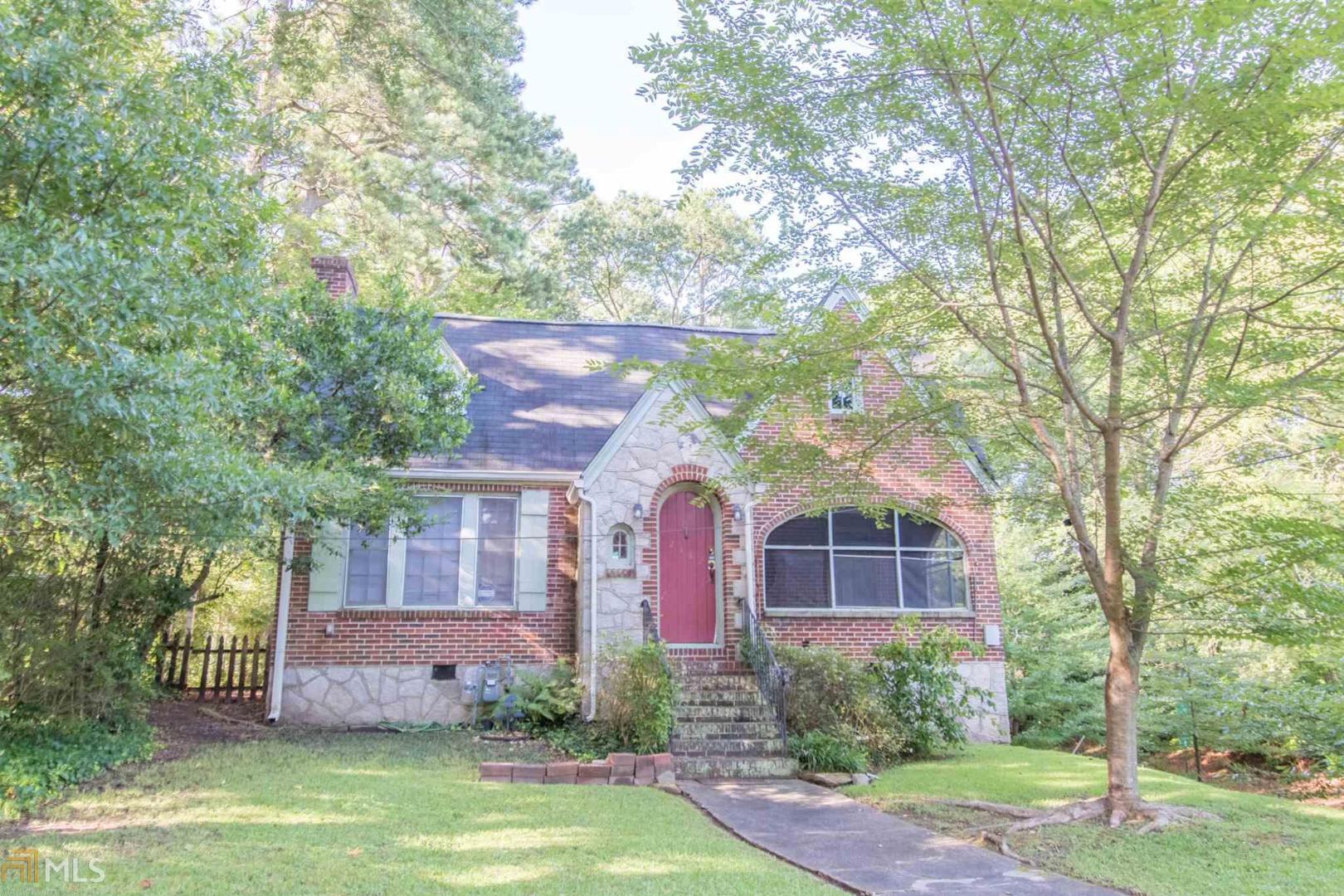 2182 Cascade Road Atlanta, GA 30311 - Photo 1 of 1 a front view of a house with a yard and fountain