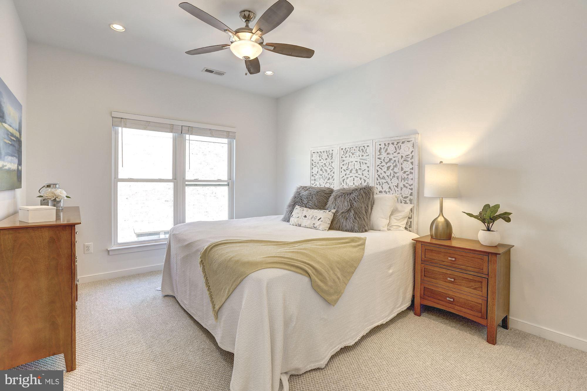 410 L Street Southeast Washington, DC 20003 - Photo 16 of 35 a bedroom with a bed and a window