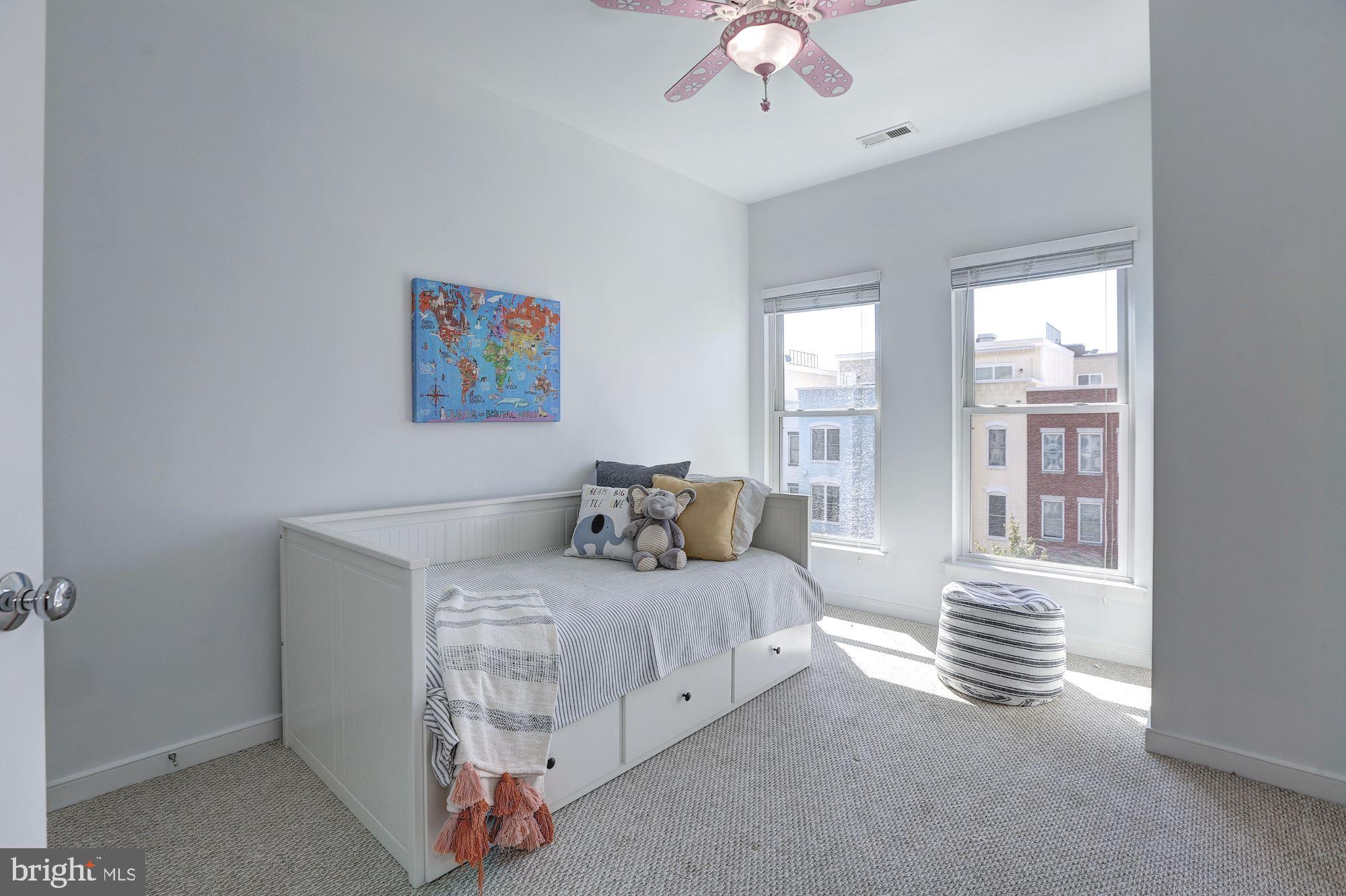 410 L Street Southeast Washington, DC 20003 - Photo 19 of 35 a bedroom with a bed and a chandelier