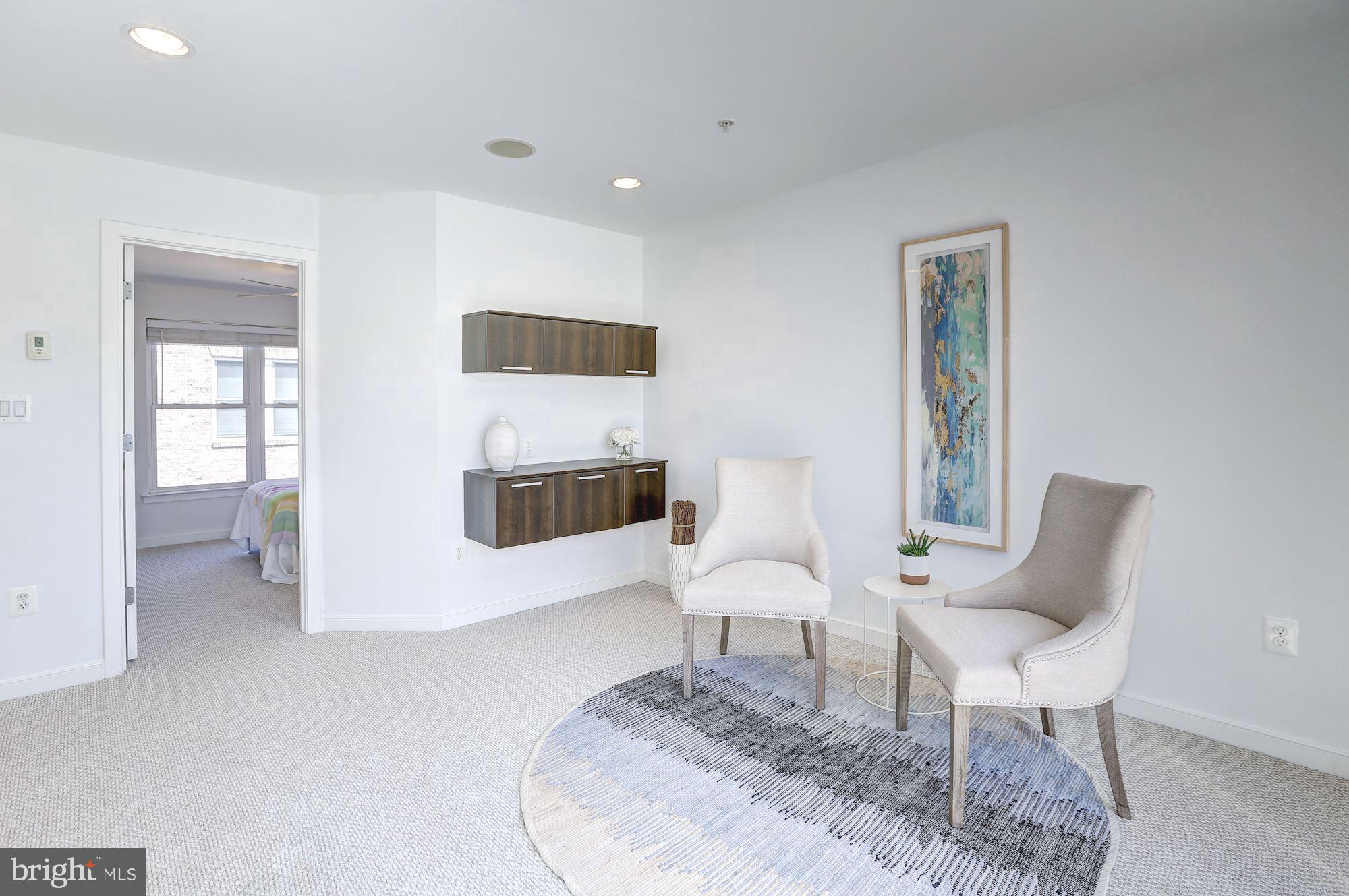 410 L Street Southeast Washington, DC 20003 - Photo 22 of 35 a living room with furniture and a chair