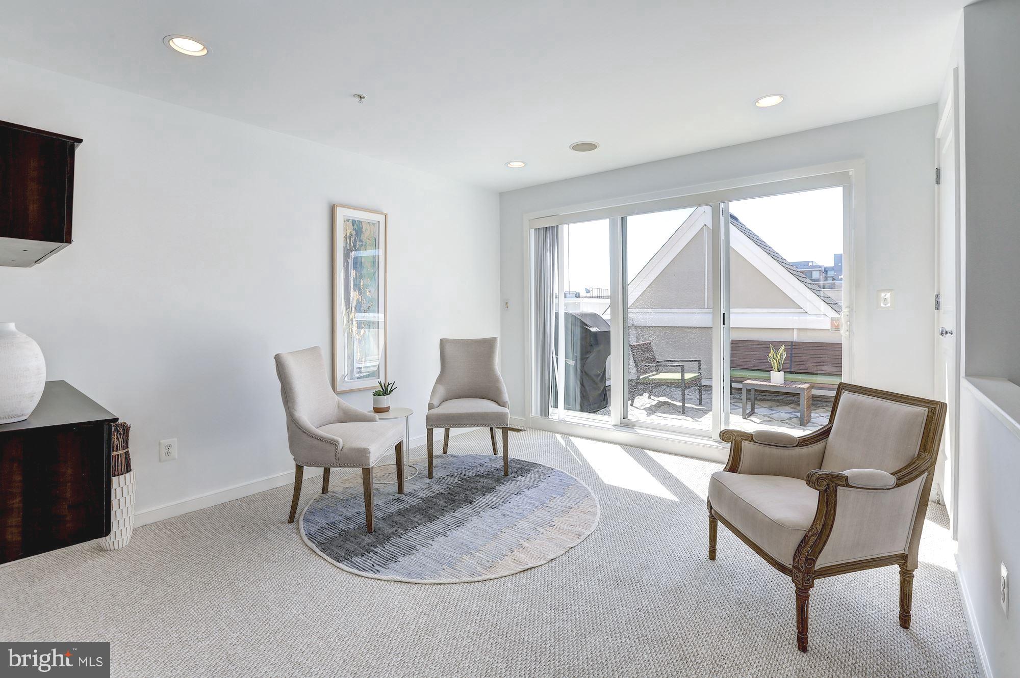410 L Street Southeast Washington, DC 20003 - Photo 23 of 35 a living room with furniture a flat screen tv and a large window