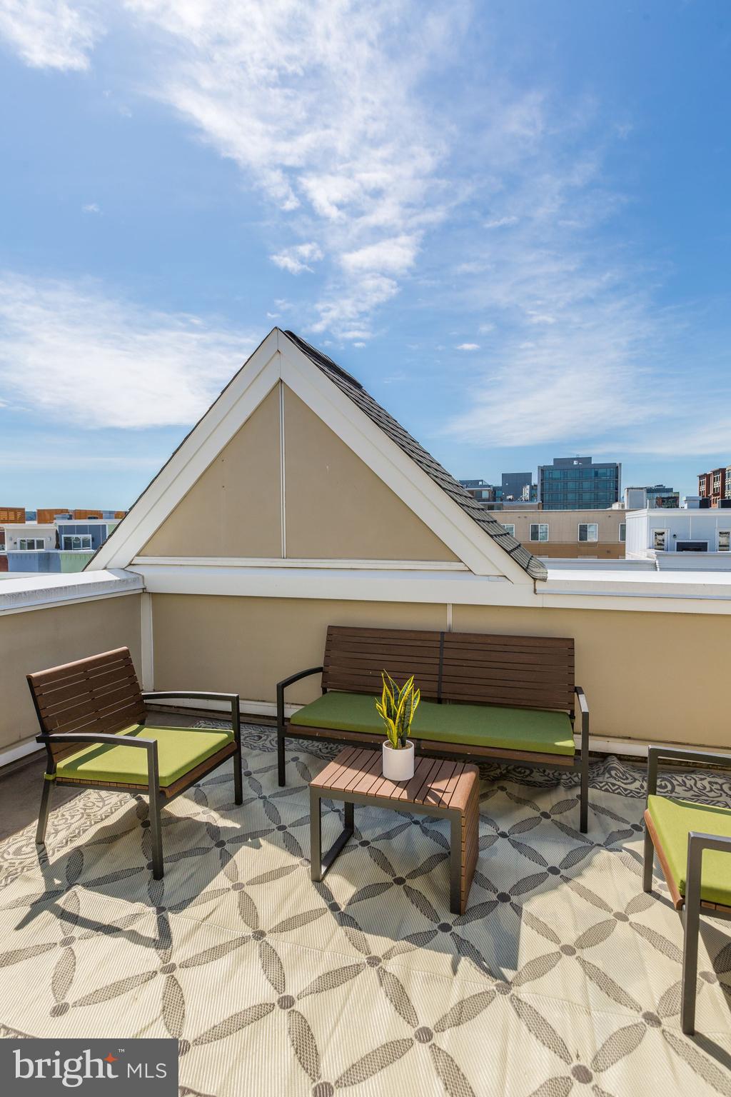 410 L Street Southeast Washington, DC 20003 - Photo 28 of 35 a roof deck with table and chairs