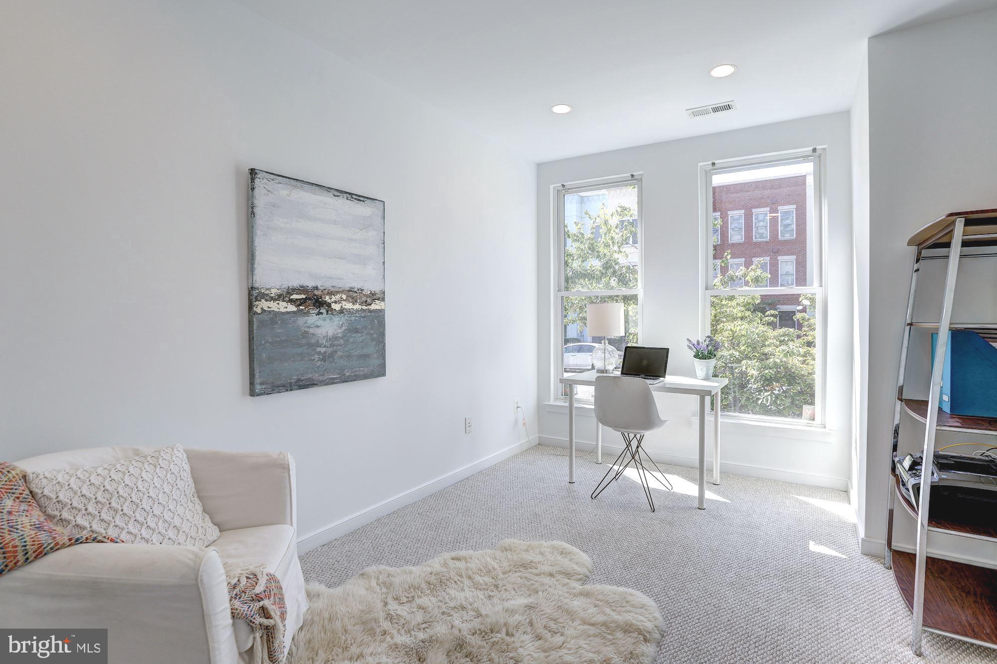 410 L Street Southeast Washington, DC 20003 - Photo 5 of 35 a living room with furniture and a window