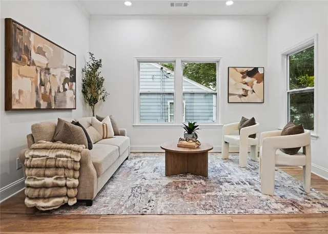 a living room with furniture and a rug
