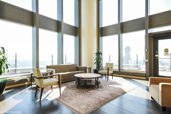 a living room with furniture and a large window