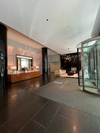 a lobby with furniture and window