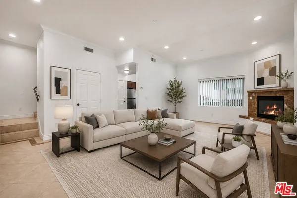 a living room with furniture fireplace and a flat screen tv