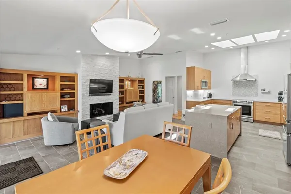 a kitchen with cabinets and refrigerator