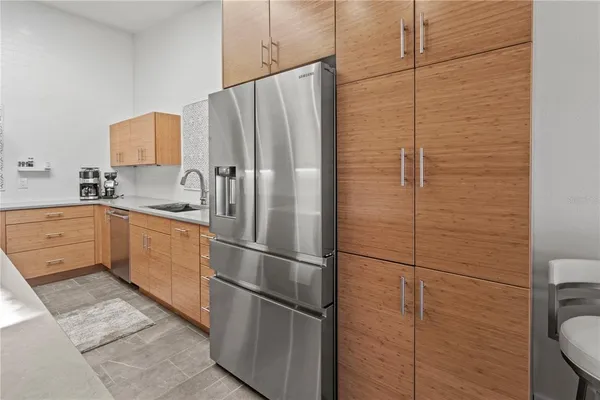 a kitchen with sink cabinets and stainless steel appliances