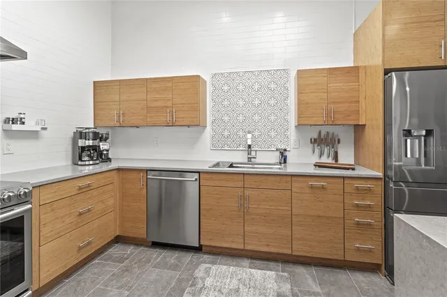 a spacious bedroom with a bed and a large window