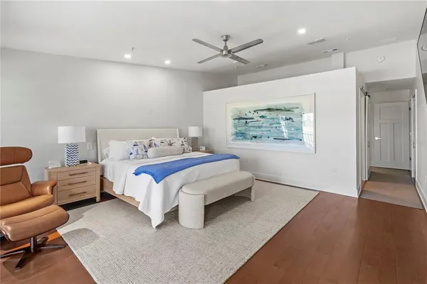 a bedroom with bed and window