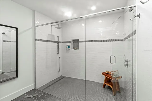 a view of a room with wooden floor and a chair