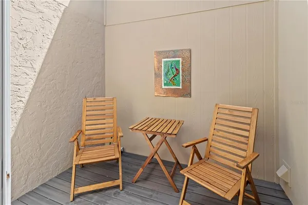a dinning table and chairs in wooden floor