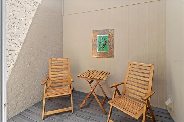 a dinning table and chairs in wooden floor