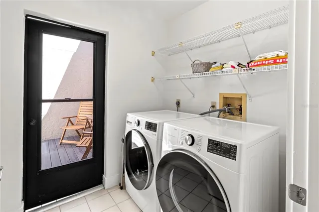 a view of a patio with couches table and chairs
