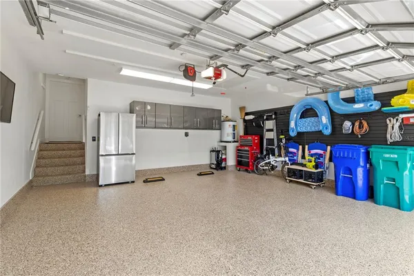a view of a patio with a table chairs and a swimming pool