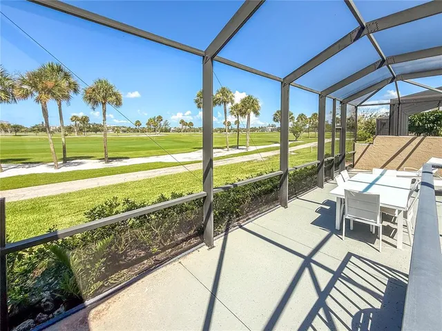 swimming pool view with a seating space