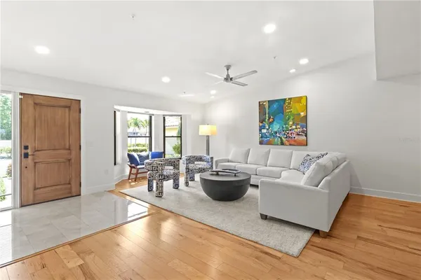 a living room with fireplace furniture and a flat screen tv