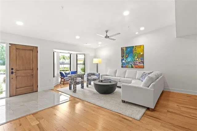 a living room with fireplace furniture and a flat screen tv