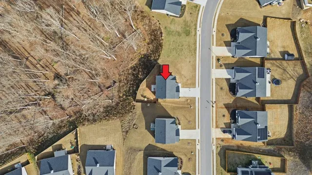 an aerial view of a backyard with outdoor seating