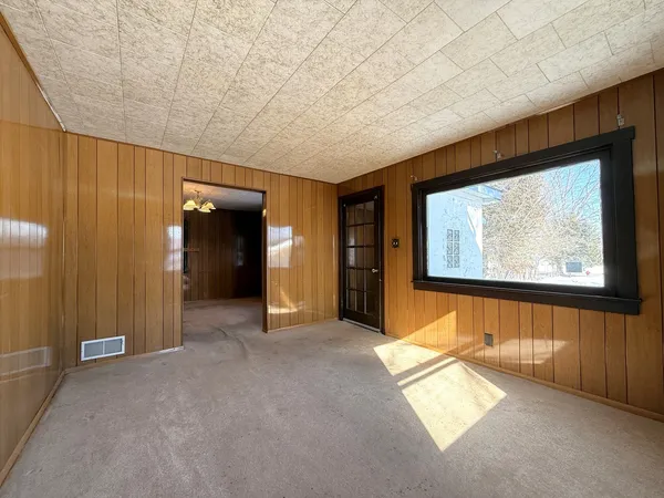 a view of an empty room and window