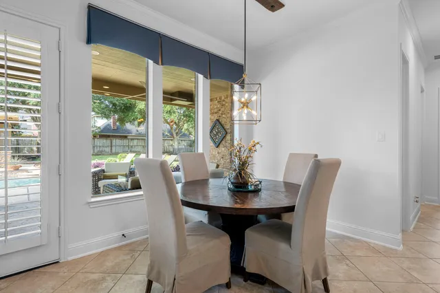 a view of a dining room with furniture window and outside view